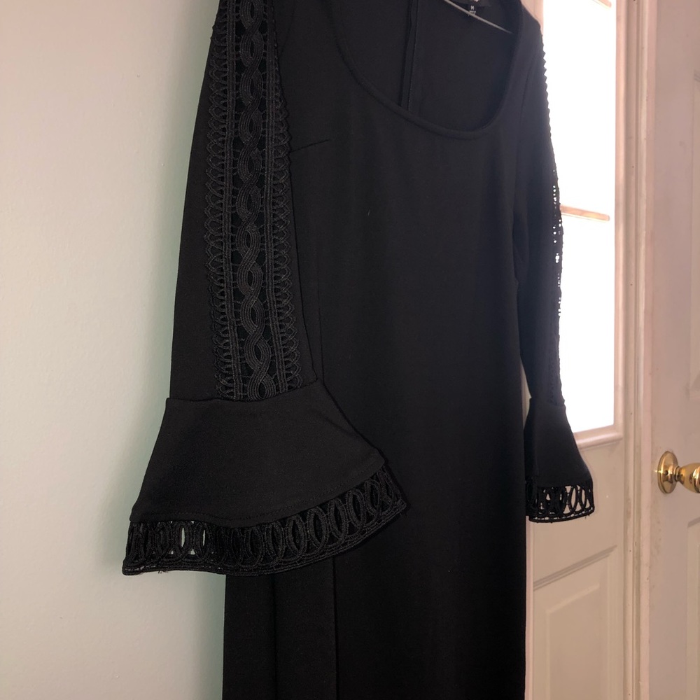 Black peplum sleeve dress from Lulu’s